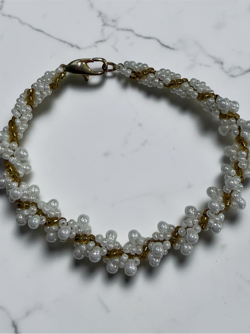 Handcrafted White Beaded Twist Bracelet with Gold Accents